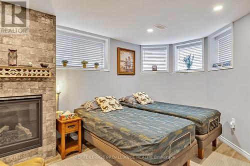 25 Brinton Drive, Peterborough (Otonabee), ON - Indoor Photo Showing Bedroom With Fireplace