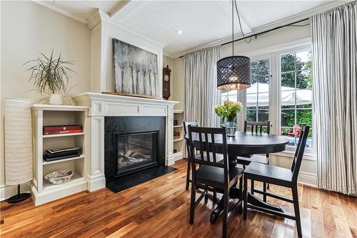 Dining area with fireplace - 607 Locust Street, Burlington, ON - Indoor Photo Showing Dining Room With Fireplace