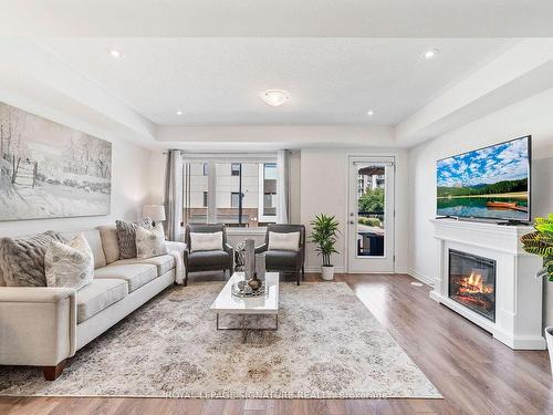 10-1125 Legar Way, Milton, ON - Indoor Photo Showing Living Room With Fireplace