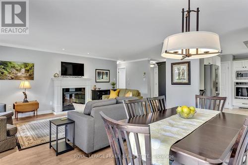 10 - 684 Whitaker Street, Peterborough (Ashburnham), ON - Indoor Photo Showing Dining Room With Fireplace