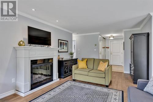 10 - 684 Whitaker Street, Peterborough (Ashburnham), ON - Indoor Photo Showing Living Room With Fireplace