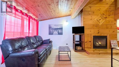 21 Huron Street, Lambton Shores (Grand Bend), ON - Indoor Photo Showing Living Room With Fireplace