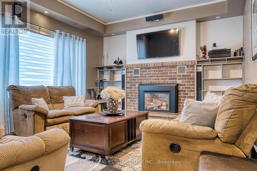 3070 Patrick Street, Howick, ON - Indoor Photo Showing Living Room With Fireplace