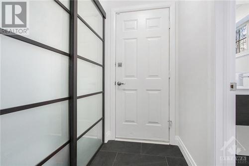 Entrance Hall with closet on one side and powder room on the other - 41 Lambton Avenue, Ottawa, ON - Indoor Photo Showing Other Room