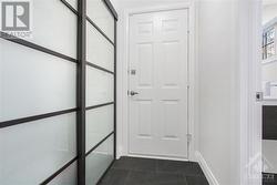 Entrance Hall with closet on one side and powder room on the other - 