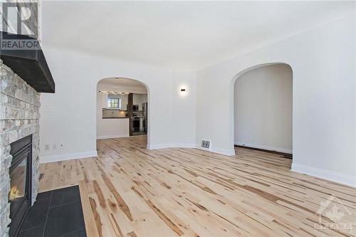 Living Room with arched entrances - 41 Lambton Avenue, Ottawa, ON - Indoor With Fireplace