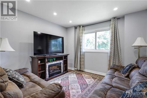 906 Cahil Drive W, Ottawa, ON - Indoor Photo Showing Living Room With Fireplace