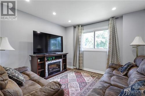 906 Cahill Drive W, Ottawa, ON - Indoor Photo Showing Living Room With Fireplace