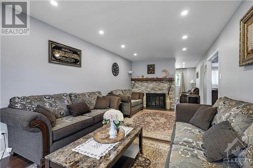 906 Cahil Drive W, Ottawa, ON - Indoor Photo Showing Living Room With Fireplace