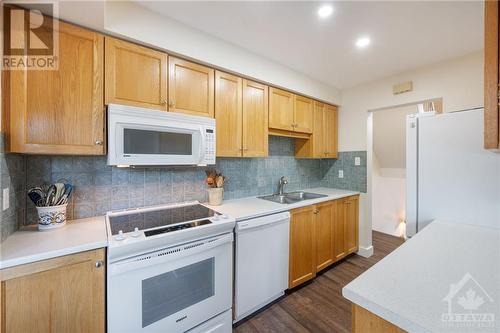 Open Kitchen with new Countertops, Sink, Hardware + Appliances - 31 Reaney Court, Kanata, ON - Indoor Photo Showing Kitchen With Double Sink