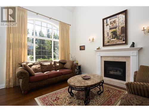 310 Woodcrest Court, Kelowna, BC - Indoor Photo Showing Living Room With Fireplace