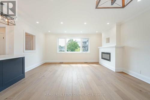 27 Garthwood Drive, Toronto (Kennedy Park), ON - Indoor Photo Showing Other Room With Fireplace