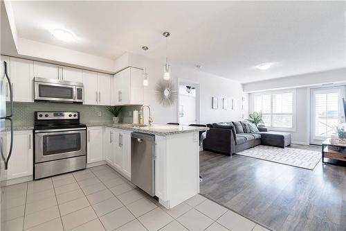 1045 Nadalin Heights|Unit #406, Milton, ON - Indoor Photo Showing Kitchen With Upgraded Kitchen