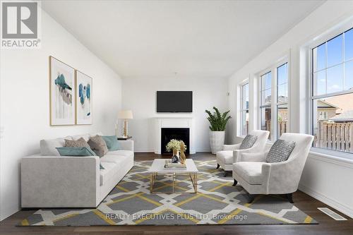 9175 White Oak Avenue, Niagara Falls (Chippawa), ON - Indoor Photo Showing Living Room With Fireplace