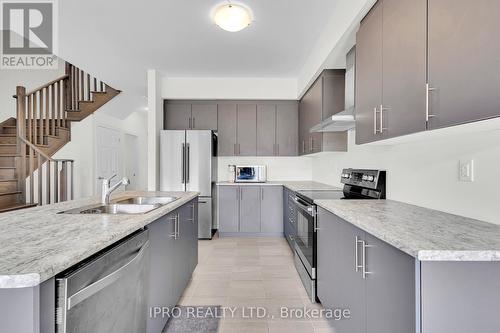 41 Povey Road, Centre Wellington (Fergus), ON - Indoor Photo Showing Kitchen With Stainless Steel Kitchen With Double Sink With Upgraded Kitchen