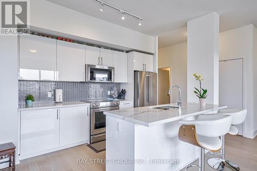 523 - 30 Shore Breeze Drive, Toronto (Mimico), ON - Indoor Photo Showing Kitchen With Upgraded Kitchen