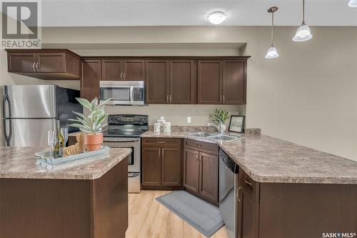 175 2Nd Avenue, Lumsden, SK - Indoor Photo Showing Kitchen With Double Sink