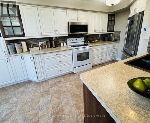 210 - 22 Hanover Road, Brampton (Queen Street Corridor), ON - Indoor Photo Showing Kitchen With Double Sink