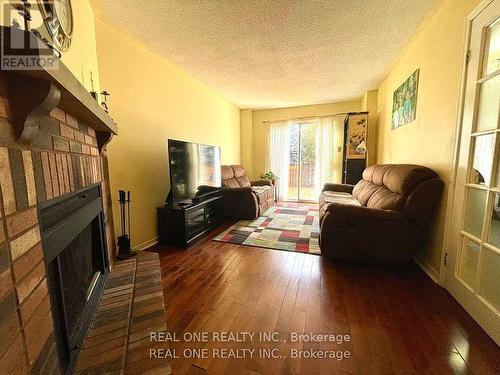 Unit 1 - 1235 Blackburn Drive, Oakville, ON - Indoor Photo Showing Living Room With Fireplace