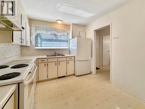 107 Ridgewood Drive, Princeton, BC - Indoor Photo Showing Kitchen With Double Sink