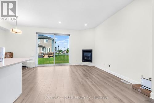 353 Buckthorn Drive W, Kingston, ON - Indoor Photo Showing Other Room With Fireplace