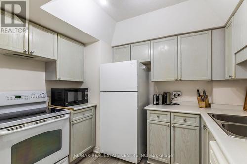 410 - 107 Bagot Street, Guelph (Onward Willow), ON - Indoor Photo Showing Kitchen With Double Sink