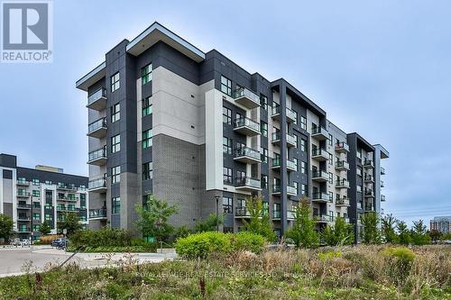 423 - 102 Grovewood Common, Oakville, ON - Outdoor With Balcony With Facade