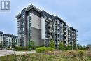 423 - 102 Grovewood Common, Oakville, ON  - Outdoor With Balcony With Facade 