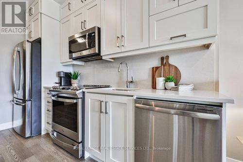 423 - 102 Grovewood Common, Oakville, ON - Indoor Photo Showing Kitchen With Stainless Steel Kitchen With Upgraded Kitchen