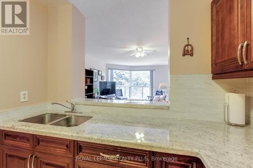 312 - 2177 Burnhamthorpe Road W, Mississauga, ON - Indoor Photo Showing Kitchen With Double Sink