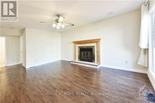 4 Balding Crescent, Ottawa, ON - Indoor Photo Showing Living Room With Fireplace