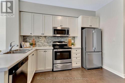 35 - 45 Royal Winter Drive, Hamilton (Binbrook), ON - Indoor Photo Showing Kitchen With Stainless Steel Kitchen With Double Sink