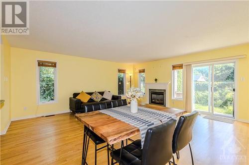 Bright Living/Dining with elegant Hardwood floor - 221 Station Boulevard Unit#11, Ottawa, ON - Indoor With Fireplace