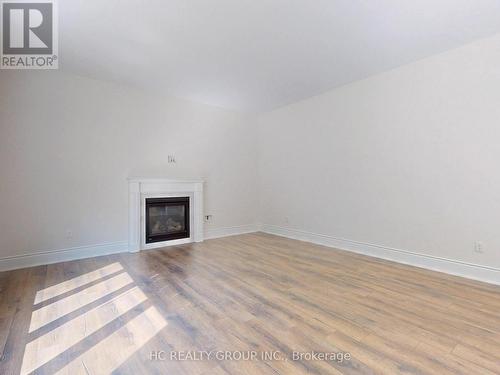 15 Trail Boulevard, Springwater, ON - Indoor Photo Showing Living Room With Fireplace