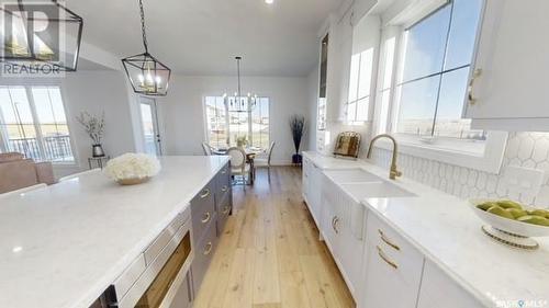 107 Woolf Bend, Saskatoon, SK - Indoor Photo Showing Kitchen With Upgraded Kitchen