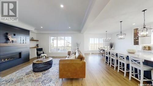 107 Woolf Bend, Saskatoon, SK - Indoor Photo Showing Living Room With Fireplace