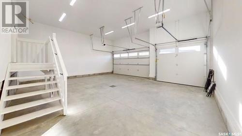 107 Woolf Bend, Saskatoon, SK - Indoor Photo Showing Garage