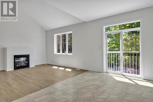 3 Hillcroft Way, Kawartha Lakes (Bobcaygeon), ON - Indoor Photo Showing Living Room With Fireplace