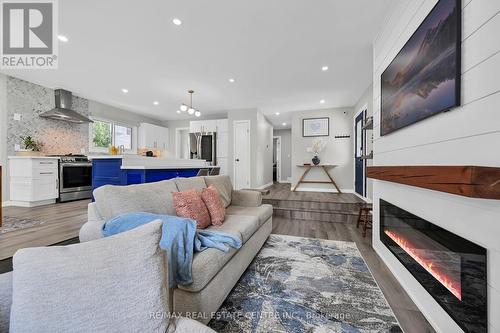 23 Ameer Drive, St. Catharines, ON - Indoor Photo Showing Living Room With Fireplace