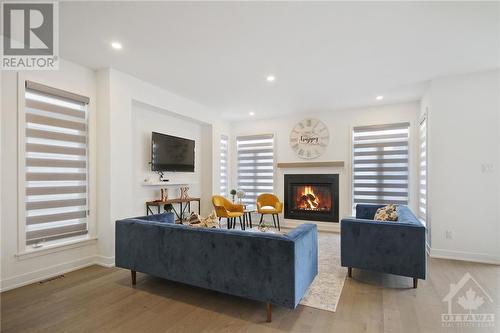 206 Osterley Way, Stittsville, ON - Indoor Photo Showing Living Room With Fireplace