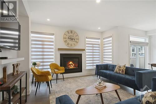 206 Osterley Way, Stittsville, ON - Indoor Photo Showing Living Room With Fireplace