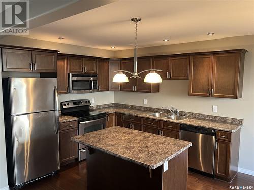 52 1600 Muzzy Drive, Prince Albert, SK - Indoor Photo Showing Kitchen With Stainless Steel Kitchen With Double Sink