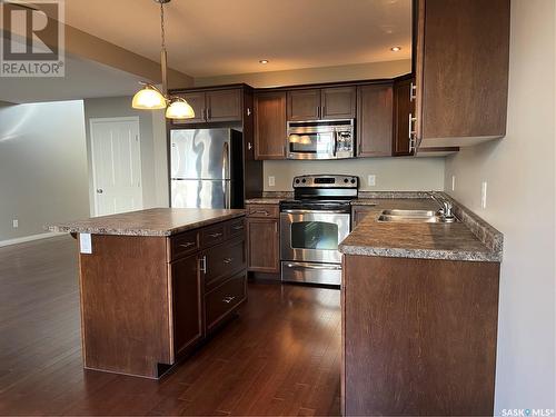 52 1600 Muzzy Drive, Prince Albert, SK - Indoor Photo Showing Kitchen With Stainless Steel Kitchen With Double Sink