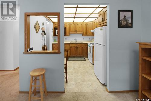 103 453 Walsh Trail, Swift Current, SK - Indoor Photo Showing Kitchen With Double Sink