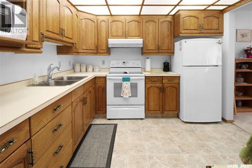 103 453 Walsh Trail, Swift Current, SK - Indoor Photo Showing Kitchen With Double Sink