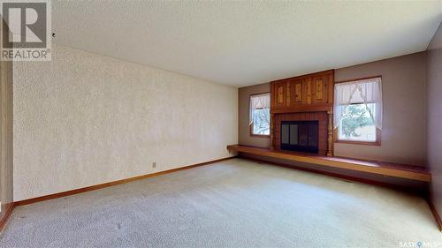 64 Cameron Crescent, Regina, SK - Indoor With Fireplace