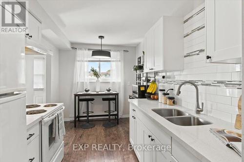 108 - 120 Nonquon Road, Oshawa (Centennial), ON - Indoor Photo Showing Kitchen With Double Sink