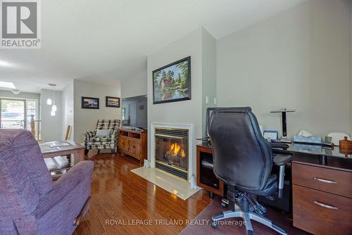 Natural Gas fireplace adding some cozy ambience - 141 - 1500 Richmond Street, London, ON - Indoor Photo Showing Office