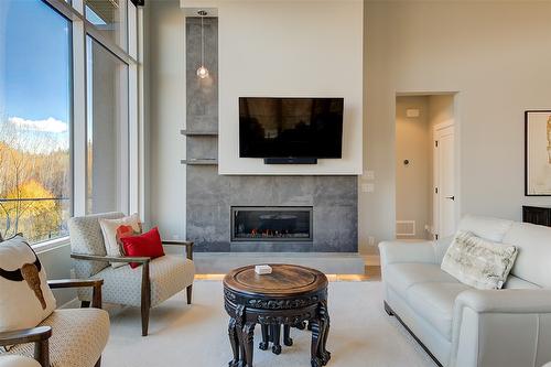 450 Windhover Court, Kelowna, BC - Indoor Photo Showing Living Room With Fireplace