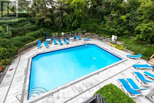 301 - 22 Clarissa Drive, Richmond Hill, ON - Outdoor With In Ground Pool With Backyard